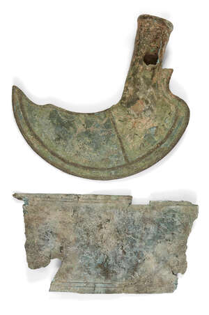 A bronze socketed sickle, Late Bronze Age, circa 1200-800 B.C., with hollow shaft, 18cm high and a Urartian bronze belt fragment, repousse decorated with leapi