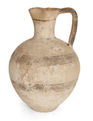 A Cypriot Iron Age Bichrome Ware amphora with pinched-in lip, the body decorated with two groups of encircling banded decoration, circa 750-475 B.C., 26cm high