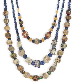 Two mostly Roman mosaic glass bead necklaces and an eye bead necklace
		1st Century B.C.-A.D. and Later
		A necklace including five Roman spherical face bead