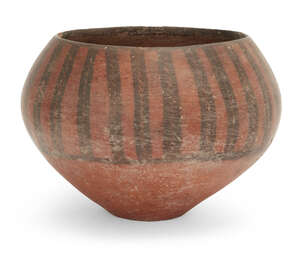 An Iranian pottery deep bowl
		Circa 4th-3rd Millennium B.C.
		the swollen body with red slip, sloping in toward the rim, decorated in black with a series of