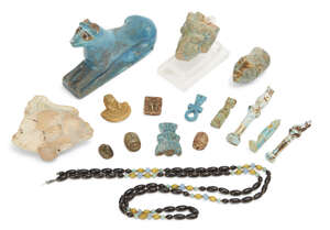 An Egyptian green glazed faience ram's head terminal
		Ptolemaic Period, circa 300-30 B.C.
		 
		With curved horns and delineated eyes, 5cm long; a Rom