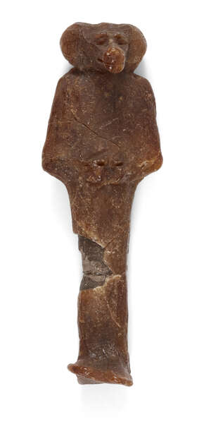 An Egyptian wax mummiform figure of one of the Four Sons of Horus, baboon headed Hapy, 3rd Intermediate Period, 21st-22nd Dynasty, 1069-715 B.C., 8.2cm high, s