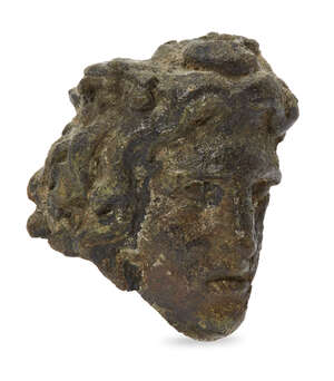 A Hellenistic fragmentary bronze hollow-backed head of a male 
		Circa 3rd-1st Century B.C
		With thick wavy hair, possibly representing Alexander the Great,